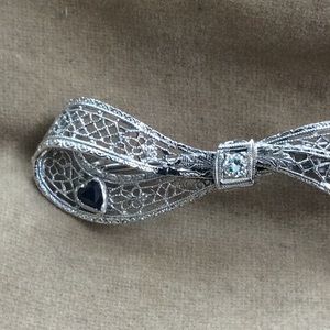 14K White solid Gold Pin with diamond and sapphire.